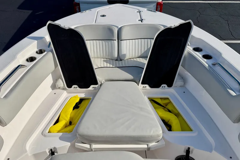 Slide: The Image of 2023 Sea Fox 228 Commander boat interior with open storage compartments and seating. - 12