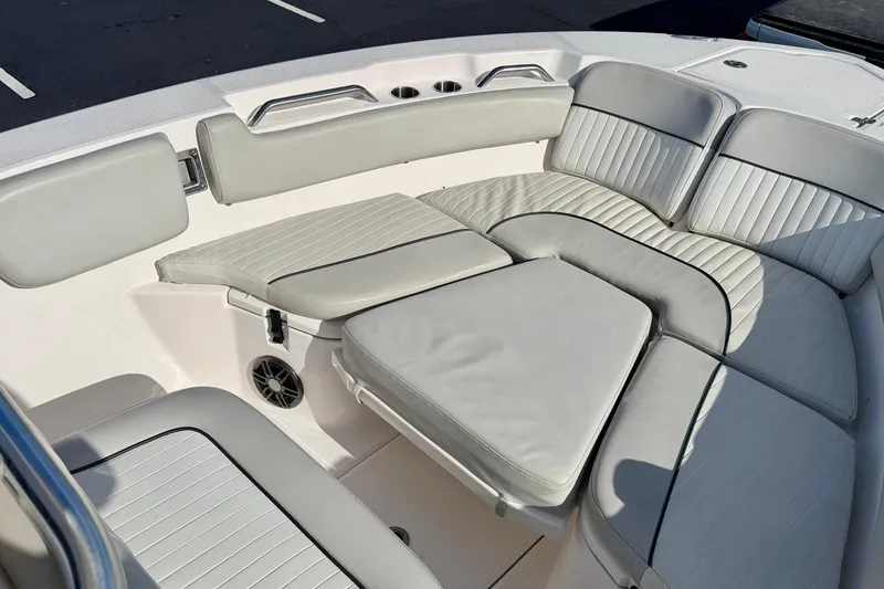 Slide: The Image of 2023 Sea Fox 228 Commander boat interior with cushioned seating and cup holders. - 14