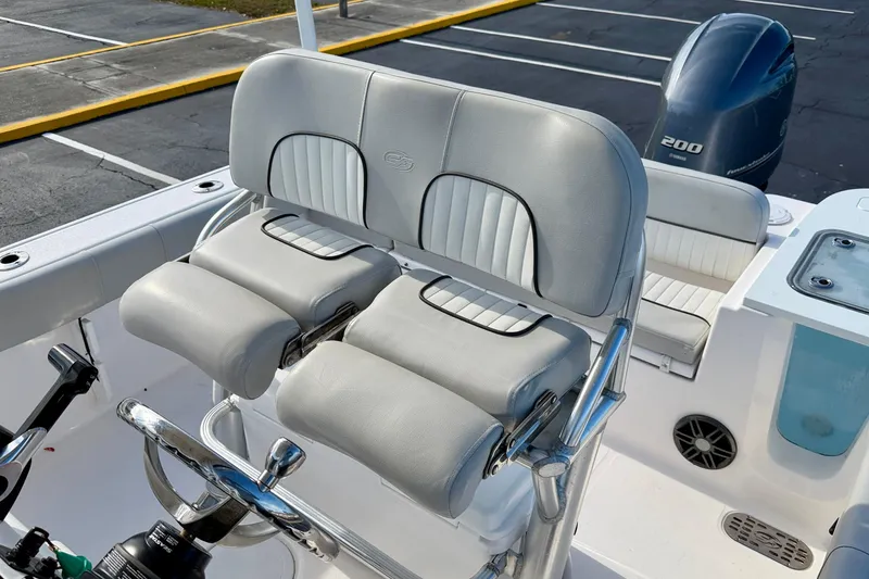 Slide: The Image of 2023 Sea Fox 228 Commander boat interior with dual helm seats and Yamaha 200 engine. - 16