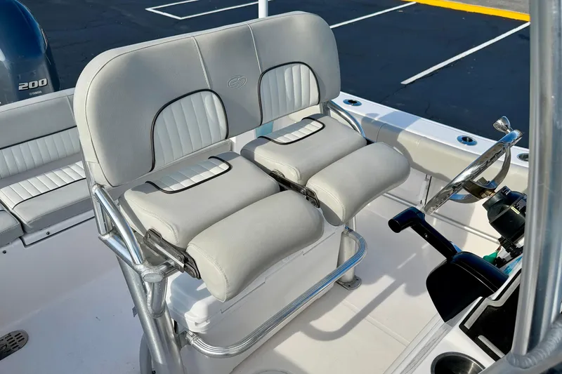 Slide: The Image of 2023 Sea Fox 228 Commander boat interior with dual seats and steering wheel. - 18