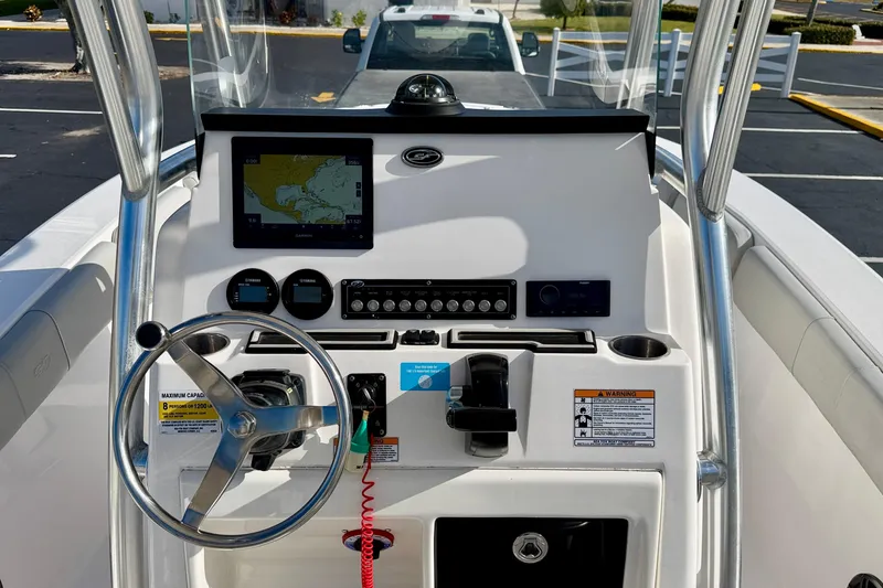 Slide: The Image of 2023 Sea Fox 228 Commander boat dashboard with steering wheel and navigation system. - 22