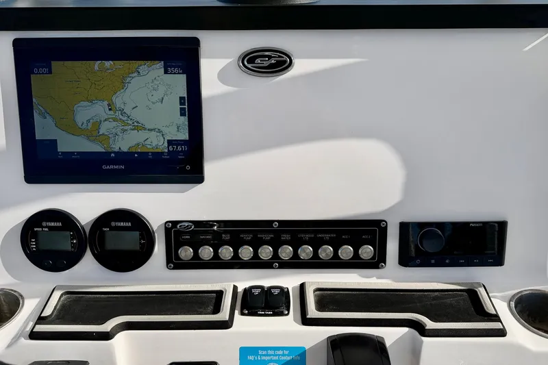Slide: The Image of 2023 Sea Fox 228 Commander dashboard with Garmin navigation and Yamaha controls. - 23