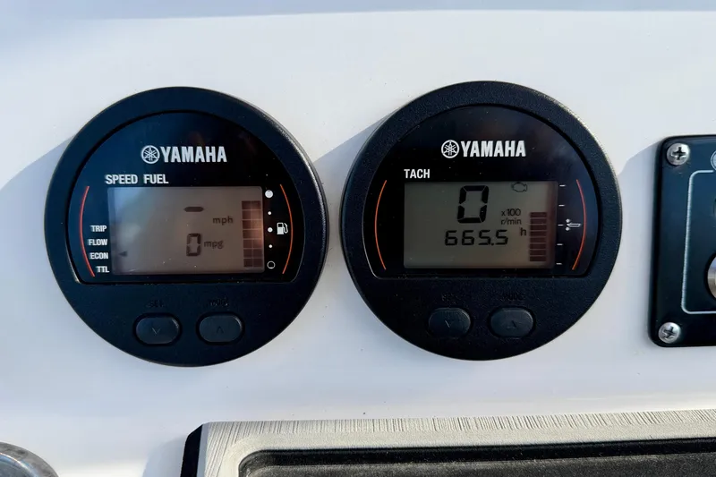 Slide: The Image of Yamaha gauges on 2023 Sea Fox 228 Commander boat dashboard, displaying speed and tachometer readings. - 27