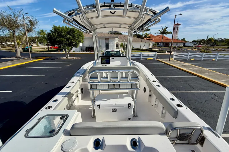 Slide: The Image of 2023 Sea Fox 228 Commander boat interior with seating and storage in a parking lot. - 31
