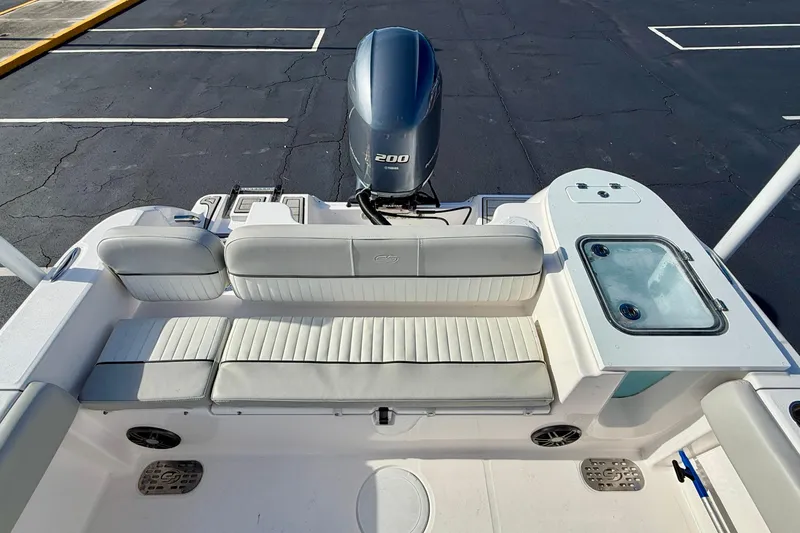 Slide: The Image of 2023 Sea Fox 228 Commander boat interior with seating and engine view. - 32