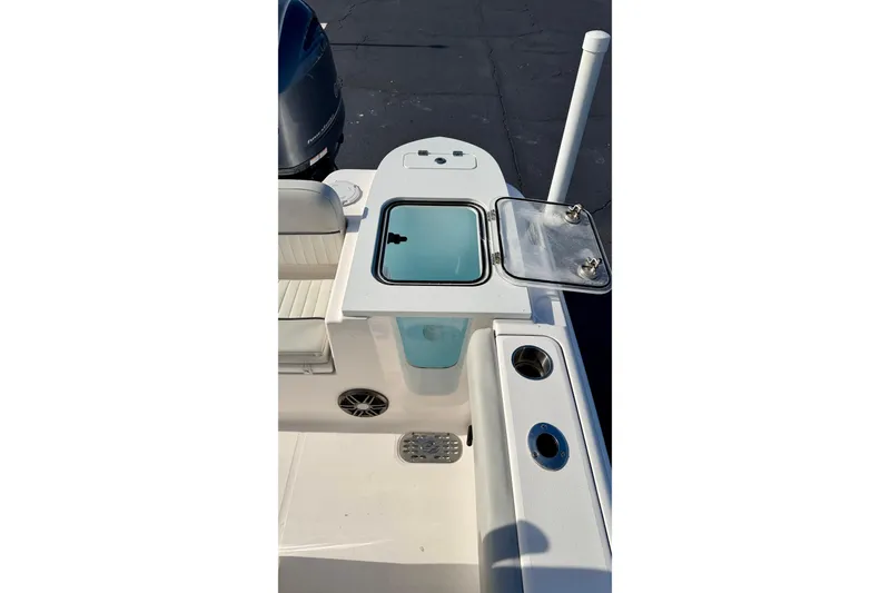 Slide: The Image of 2023 Sea Fox 228 Commander boat deck with open storage compartment. - 34