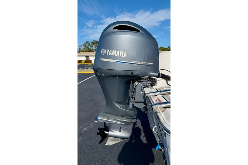Slide: The Image of Yamaha outboard motor on 2023 Sea Fox 228 Commander boat, parked outdoors. - 39