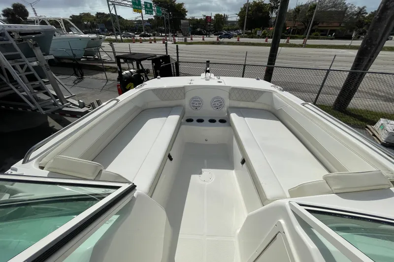 Slide: The Image of 2026 World Cat 230 DC boat interior with seating and storage compartments. - 11