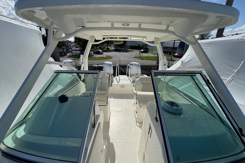 Slide: The Image of 2026 World Cat 230 DC boat interior with dual consoles and spacious seating. - 14