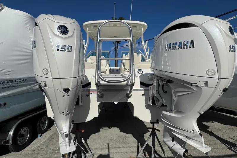 Slide: The Image of 2026 World Cat 230 DC boat with twin Yamaha 150 outboard engines. - 16