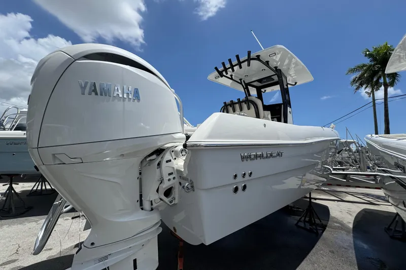 Slide: The Image of 2026 World Cat 235 TE boat with Yamaha engine under clear blue sky. - 1