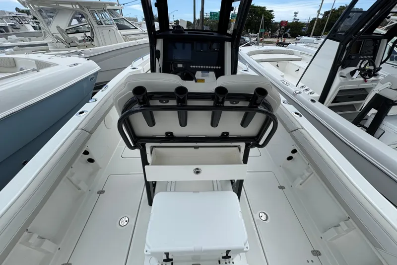 Slide: The Image of 2026 World Cat 235 TE boat interior with rod holders and seating. - 10