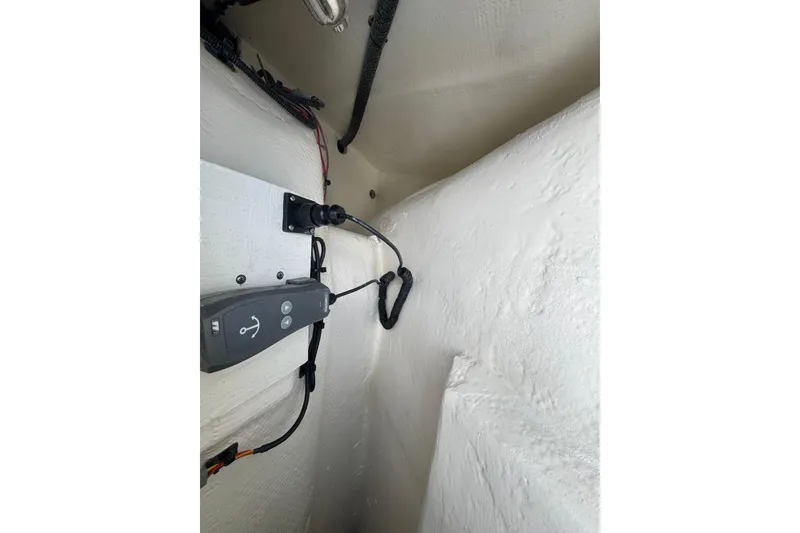 Slide: The Image of Interior view of 2026 World Cat 235 TE boat wiring and control panel. - 14