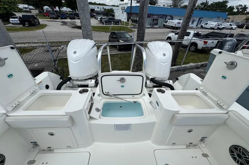 Slide: The Image of 2026 World Cat 235 TE boat with dual engines and open storage compartments. - 4