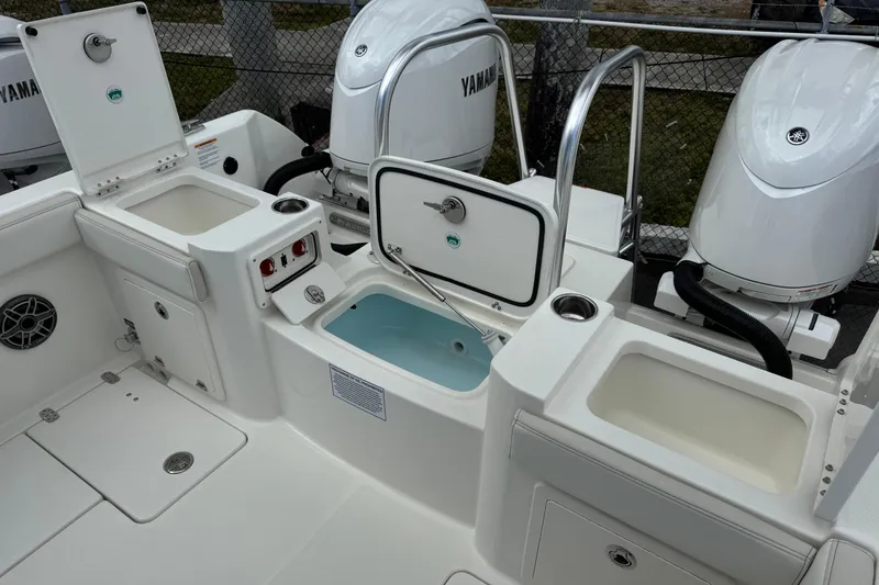 Slide: The Image of 2026 World Cat 235 TE boat interior with Yamaha engines and storage compartments. - 6