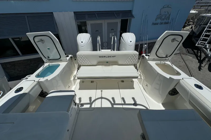 Slide: The Image of 2026 World Cat 265 DC-X boat interior with open storage compartments and seating. - 10