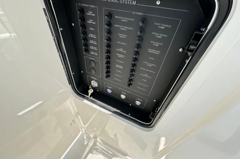 Slide: The Image of Electrical panel of 2026 World Cat 265 DC-X boat, showcasing various system controls. - 16