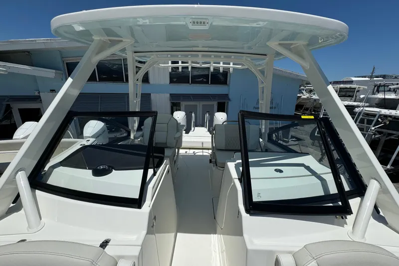 Slide: The Image of 2026 World Cat 265 DC-X boat interior with dual consoles and seating. - 19