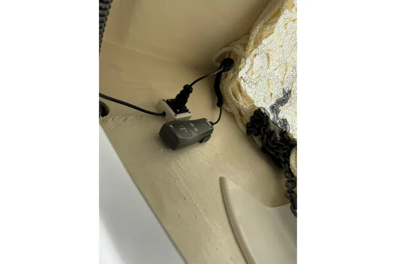 Slide: The Image of 2026 World Cat 265 DC-X boat interior with electrical plug and chain detail. - 26