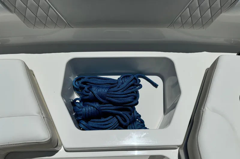 Slide: The Image of Storage compartment with blue rope on 2026 World Cat 265 DC-X boat. - 28