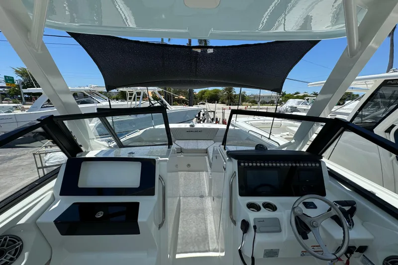Slide: The Image of 2026 World Cat 265 DC-X boat interior with modern dashboard and steering wheel. - 5
