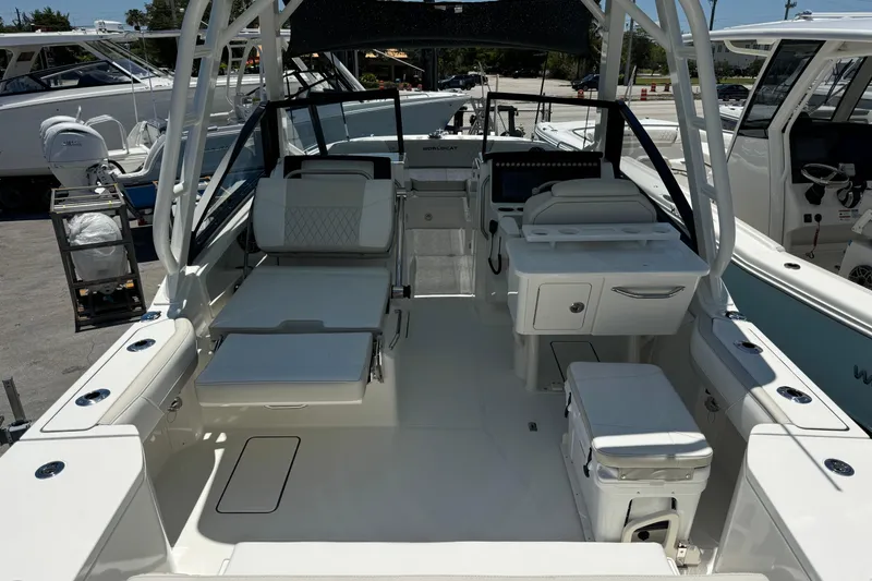 Slide: The Image of 2026 World Cat 265 DC-X boat interior with seating and helm station. - 8