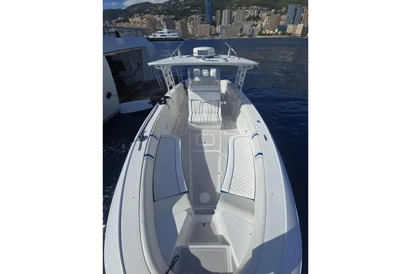 Slide: The Image of 2014 Midnight Express 37 EXK boat on water, cityscape background. - 14