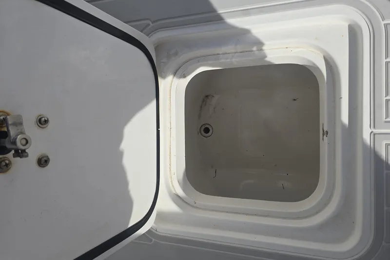 Slide: The Image of Open storage compartment on 2014 Midnight Express 37 EXK boat. - 16