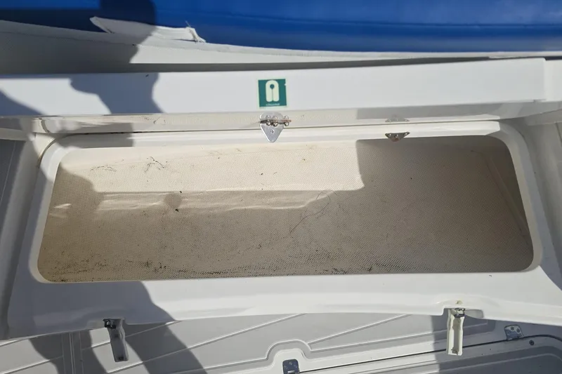 Slide: The Image of Open storage compartment on a 2014 Midnight Express 37 EXK boat. - 17