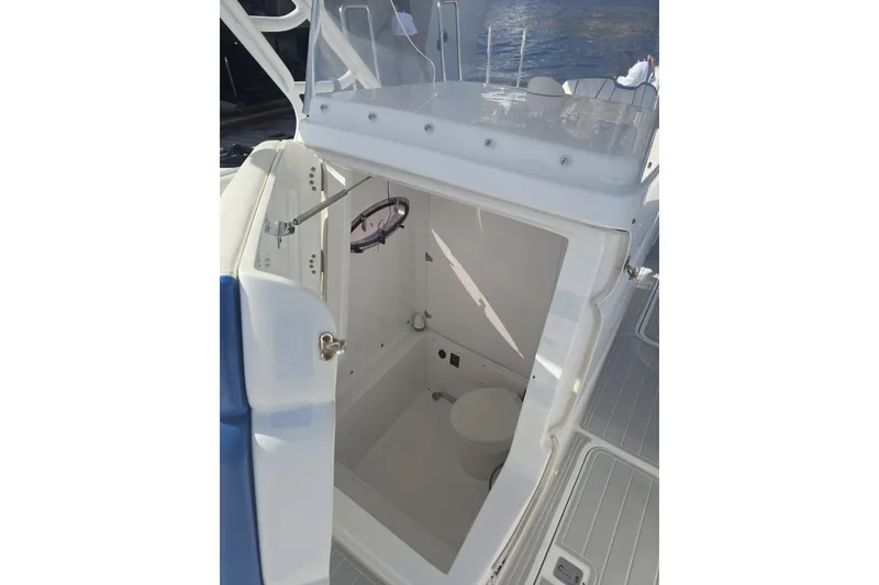 Slide: The Image of 2014 Midnight Express 37 EXK boat interior with open cabin door and visible toilet. - 19