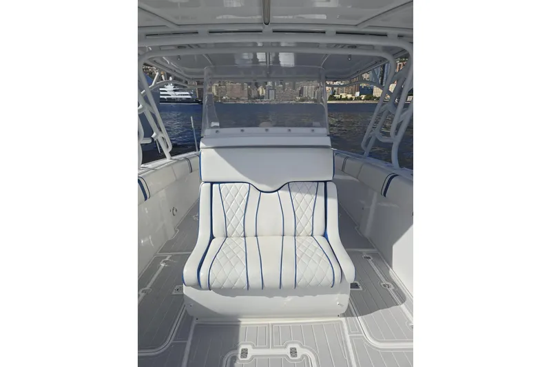 Slide: The Image of Interior of 2014 Midnight Express 37 EXK boat with white and blue seating. - 20