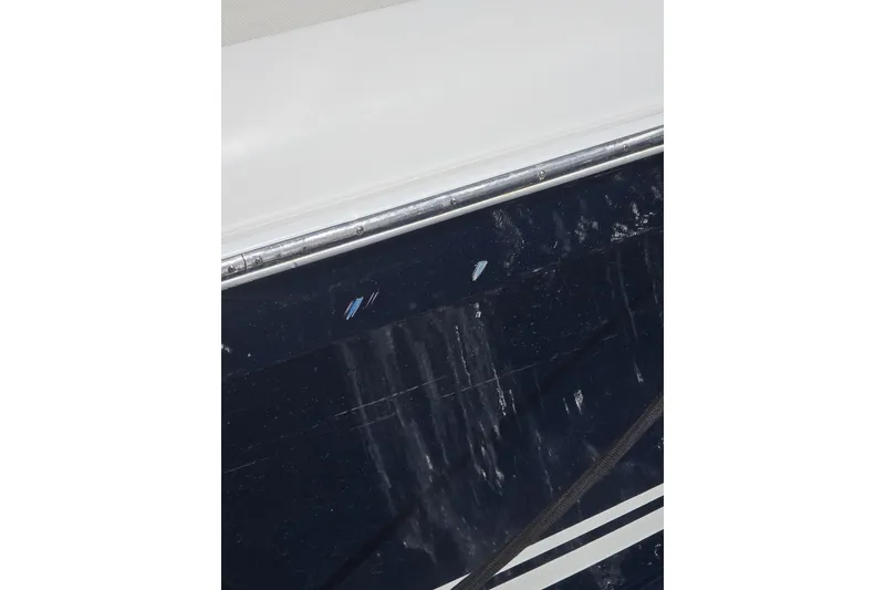 Slide: The Image of Close-up of 2014 Midnight Express 37 EXK boat hull with visible wear. - 27