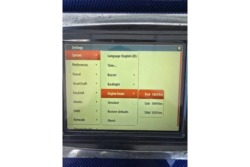Slide: The Image of Touchscreen display showing engine hours for a 2014 Midnight Express 37 EXK boat. - 28