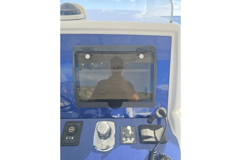 Slide: The Image of Control panel of a 2014 Midnight Express 37 EXK boat with navigation equipment. - 31