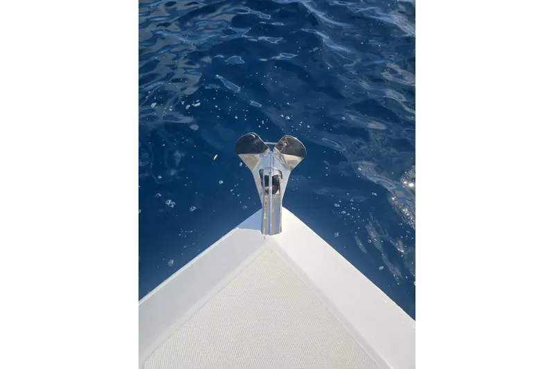 Slide: The Image of Bow of 2014 Midnight Express 37 EXK boat on clear blue water. - 35