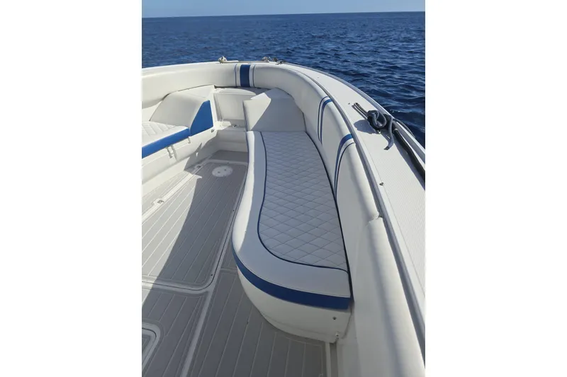 Slide: The Image of 2014 Midnight Express 37 EXK boat interior with white and blue seating, ocean view. - 36