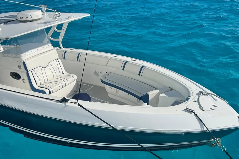 Slide: The Image of 2014 Midnight Express 37 EXK boat on clear blue water. - 7