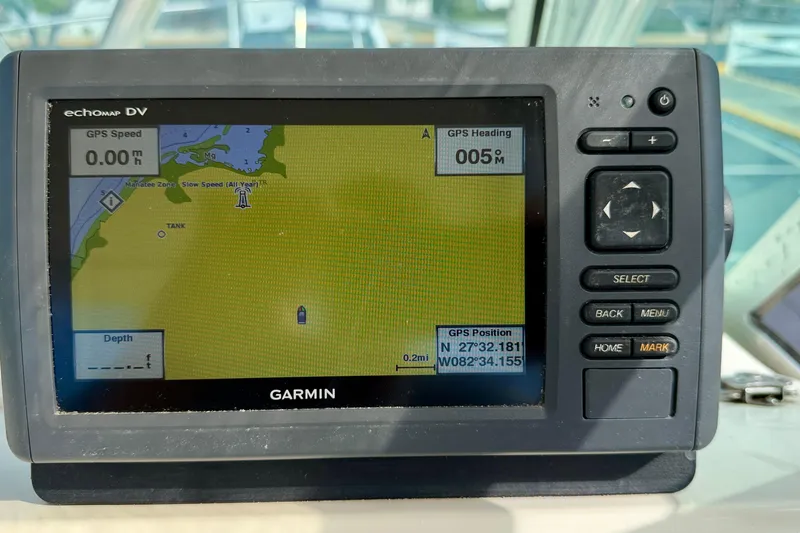 Slide: The Image of Garmin GPS display on 1999 Pursuit 2470 Walkaround boat, showing navigation details. - 24