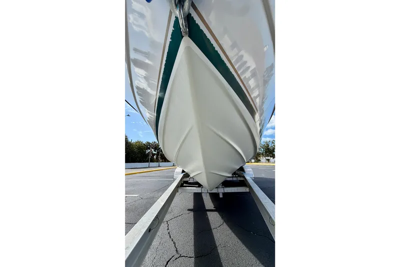 Slide: The Image of 1999 Pursuit 2470 Walkaround boat on trailer, viewed from below. - 8