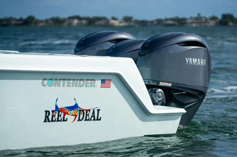 Slide: The Image of 2025 Contender 39 ST boat with Yamaha engines on the water. - 8