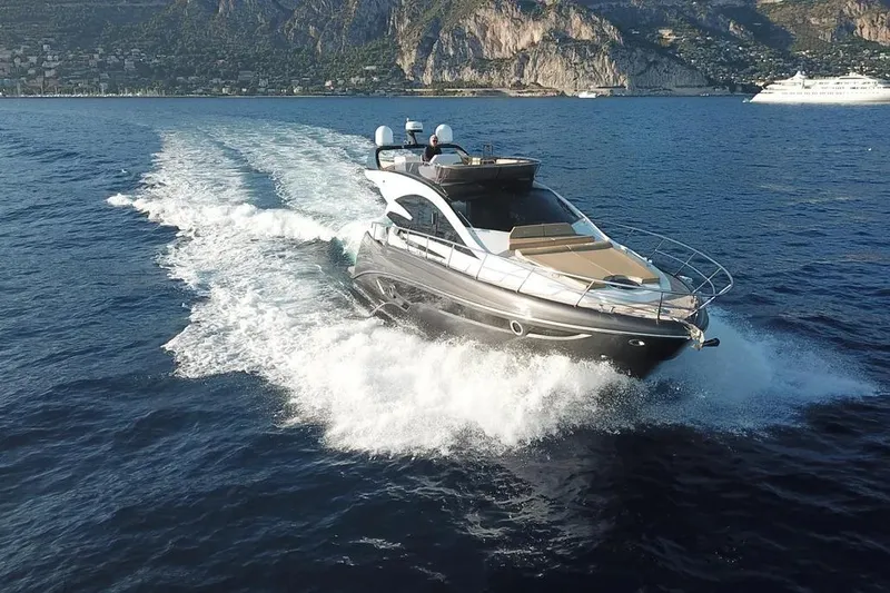 Slide: The Image of Luxury Cobrey 52 FLY yacht cruising on open water, 2025 model. - 4