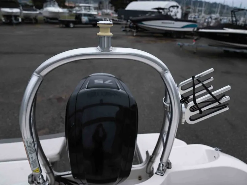 Slide: The Image of 2016 Bayliner Element E16 with outboard motor and watersport equipment. - 18
