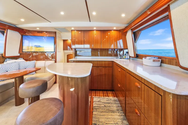 Slide: The Image of Luxurious interior of 2013 Viking 46 Convertible yacht with elegant wood finishes and ocean view. - 15