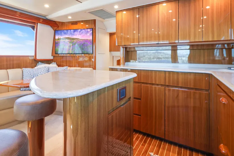 Slide: The Image of Luxurious interior of 2013 Viking 46 Convertible yacht with polished wood cabinetry. - 16