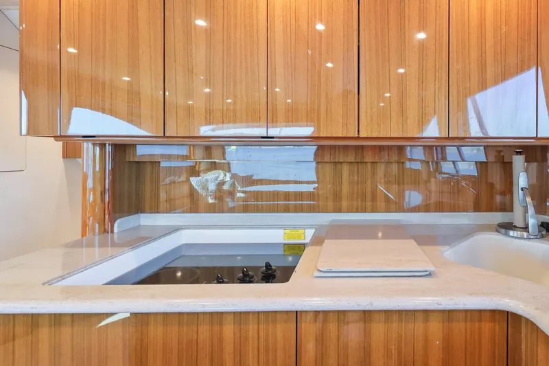 Slide: The Image of Luxurious kitchen interior of 2013 Viking 46 Convertible yacht with wooden cabinetry. - 18