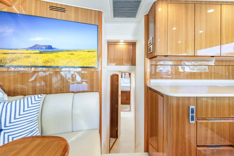 Slide: The Image of Luxurious interior of 2013 Viking 46 Convertible yacht with wood finishes and modern amenities. - 26