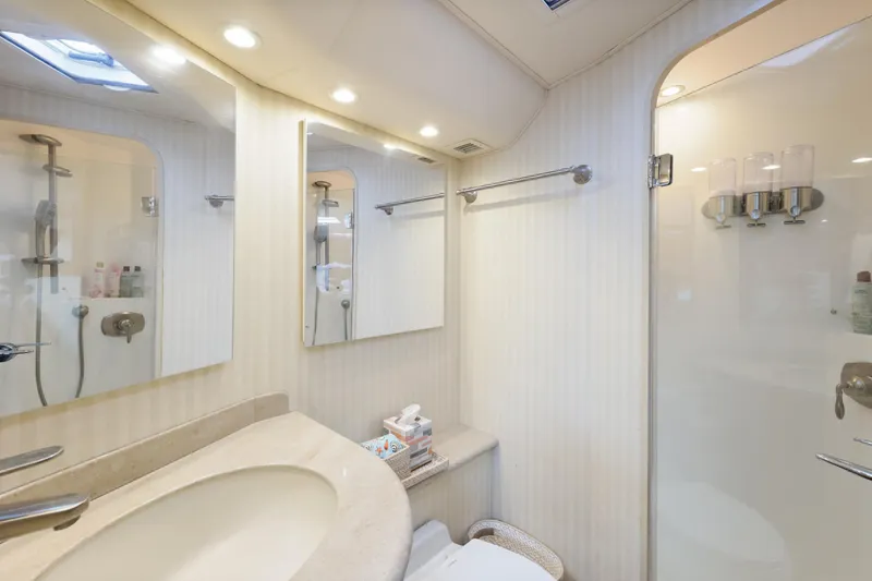 Slide: The Image of Luxurious bathroom in 2013 Viking 46 Convertible yacht with modern fixtures and shower. - 29