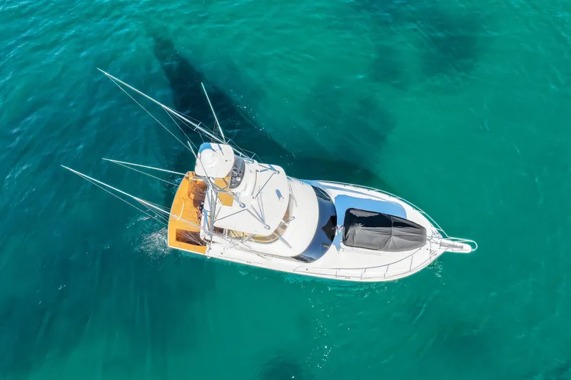 Slide: The Image of Aerial view of 2013 Viking 46 Convertible yacht on clear turquoise water. - 3