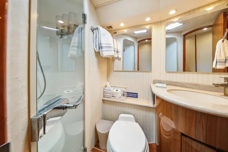 Slide: The Image of Luxurious bathroom in 2013 Viking 46 Convertible yacht with modern fixtures and elegant design. - 31