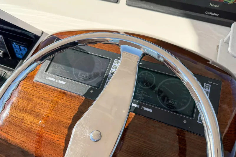 Slide: The Image of Steering wheel and dashboard of 2013 Viking 46 Convertible yacht. - 44